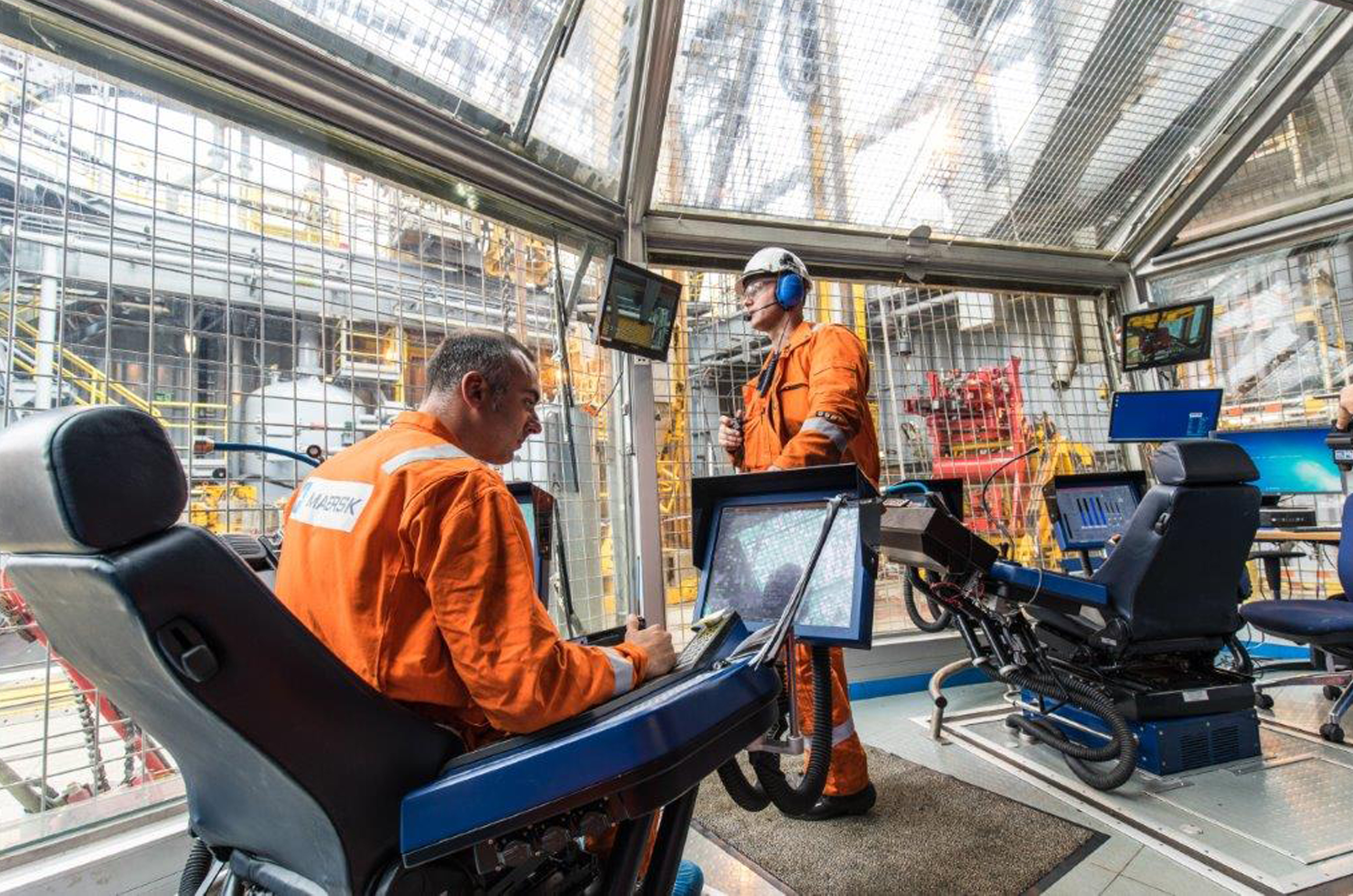 Offshore workers in control room